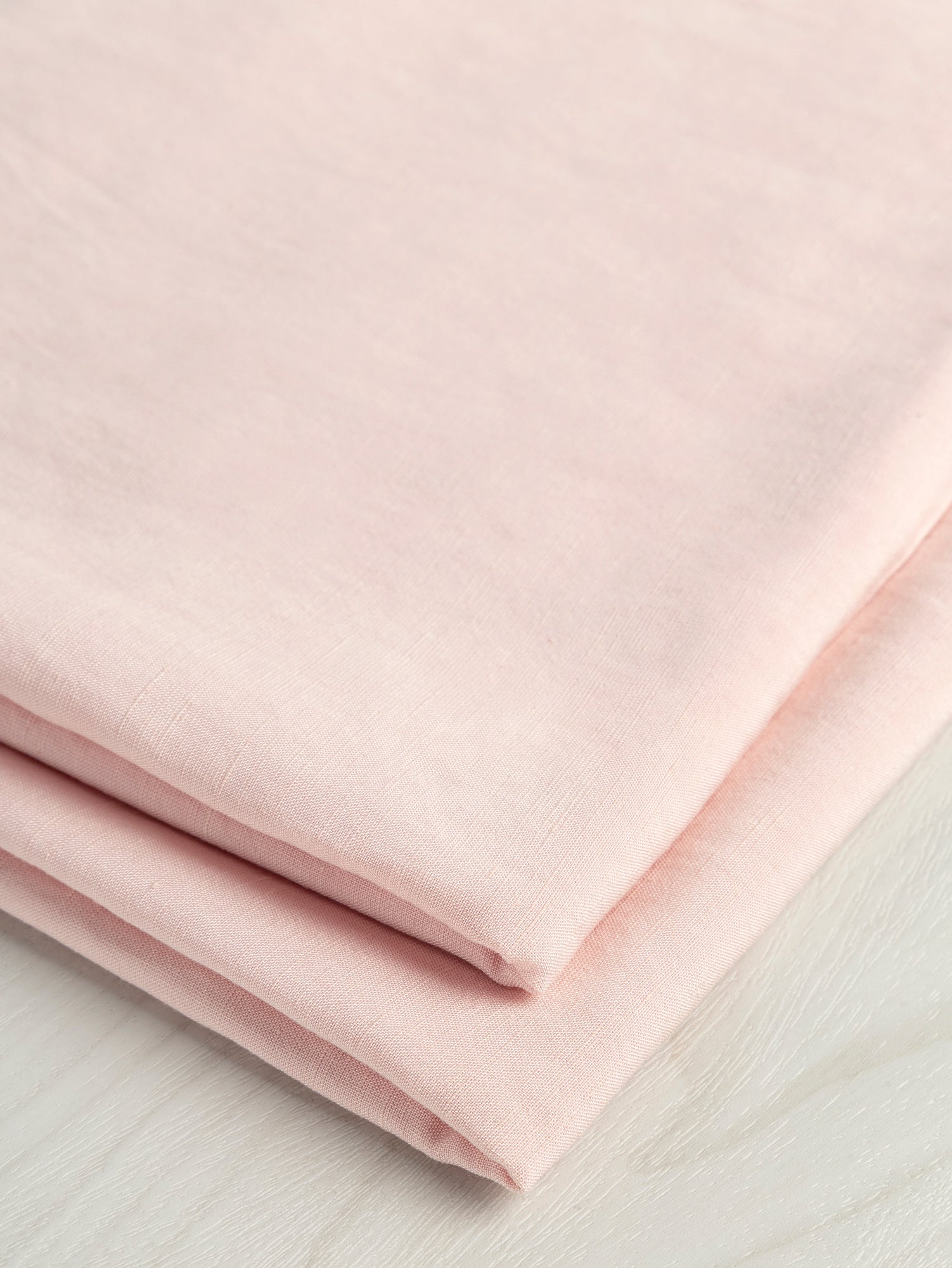 F-DEA054-002-Textured-Viscose-Linen-Deadstock-Powder-Pink-Core-Fabrics-fold.JPG