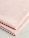 F-DEA054-002-Textured-Viscose-Linen-Deadstock-Powder-Pink-Core-Fabrics-fold.JPG