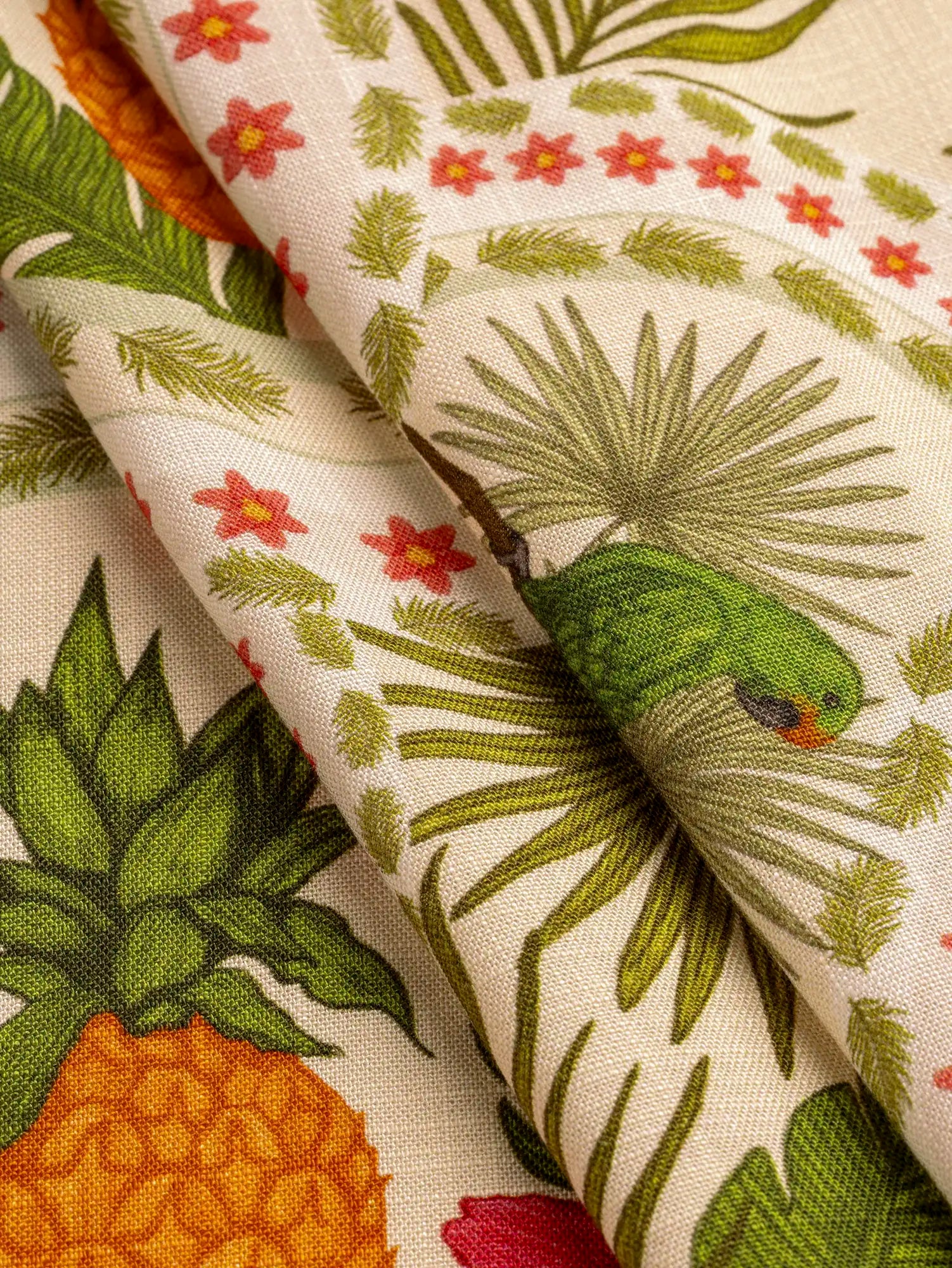 F-VIS312-Tropical-Fruits-Parrot-Print-Textured-Ecovero-Viscose-Oat-Basil-and-Cherry-Core-Fabrics-fold.webp