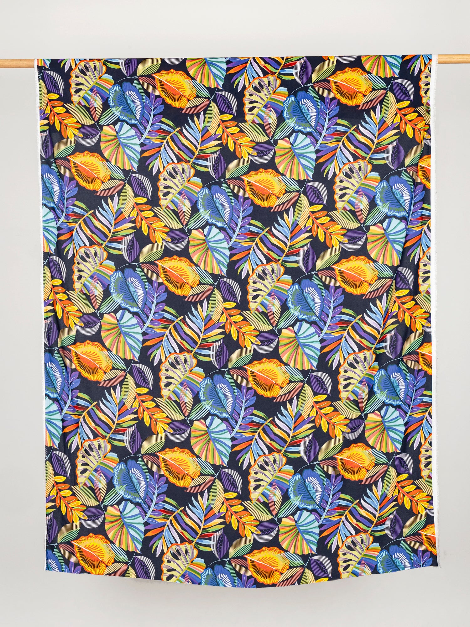 F-VIS246-Tropical-Leaf-Print-Ecovero-Viscose-Black+Pink+Orange+Violet-Core-Fabrics-draped.JPG