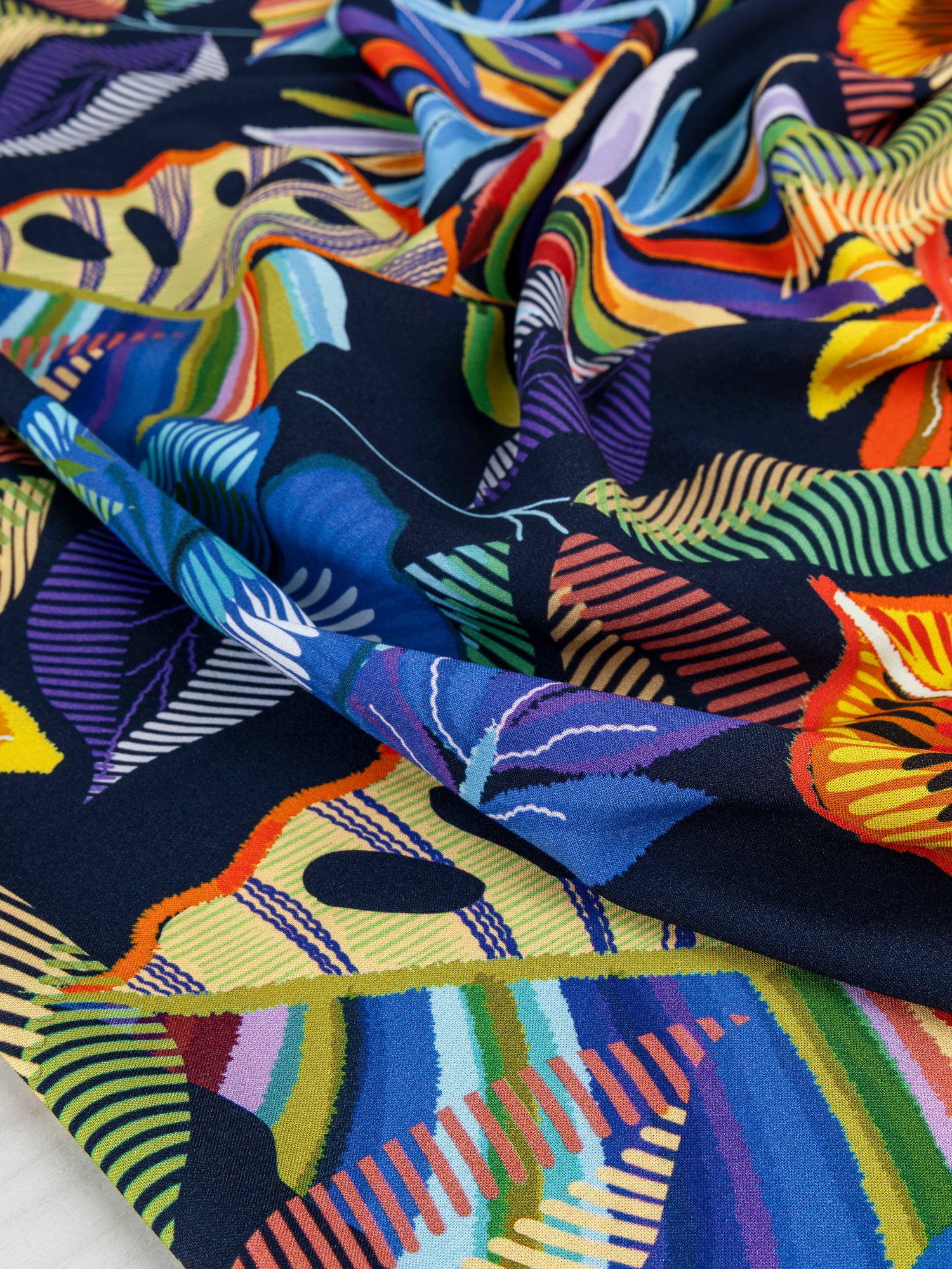 F-VIS246-Tropical-Leaf-Print-Ecovero-Viscose-Black+Pink+Orange+Violet-Core-Fabrics-scrunched.JPG