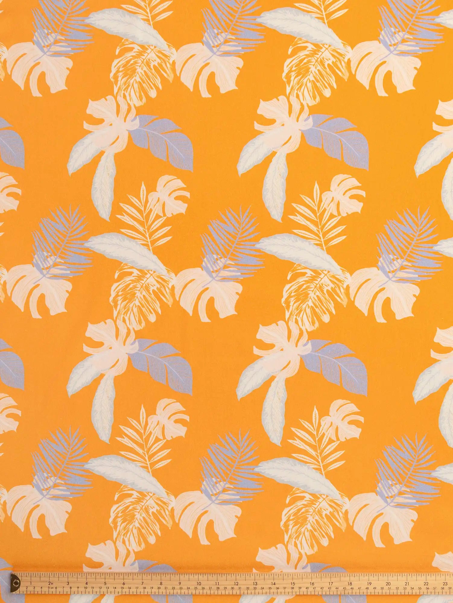 F-DEA242-Tropical-Print-Stretch-Cotton-Woven-Deadstock-Orange-Lavender-and-Mist-Core-Fabrics-ruler.webp
