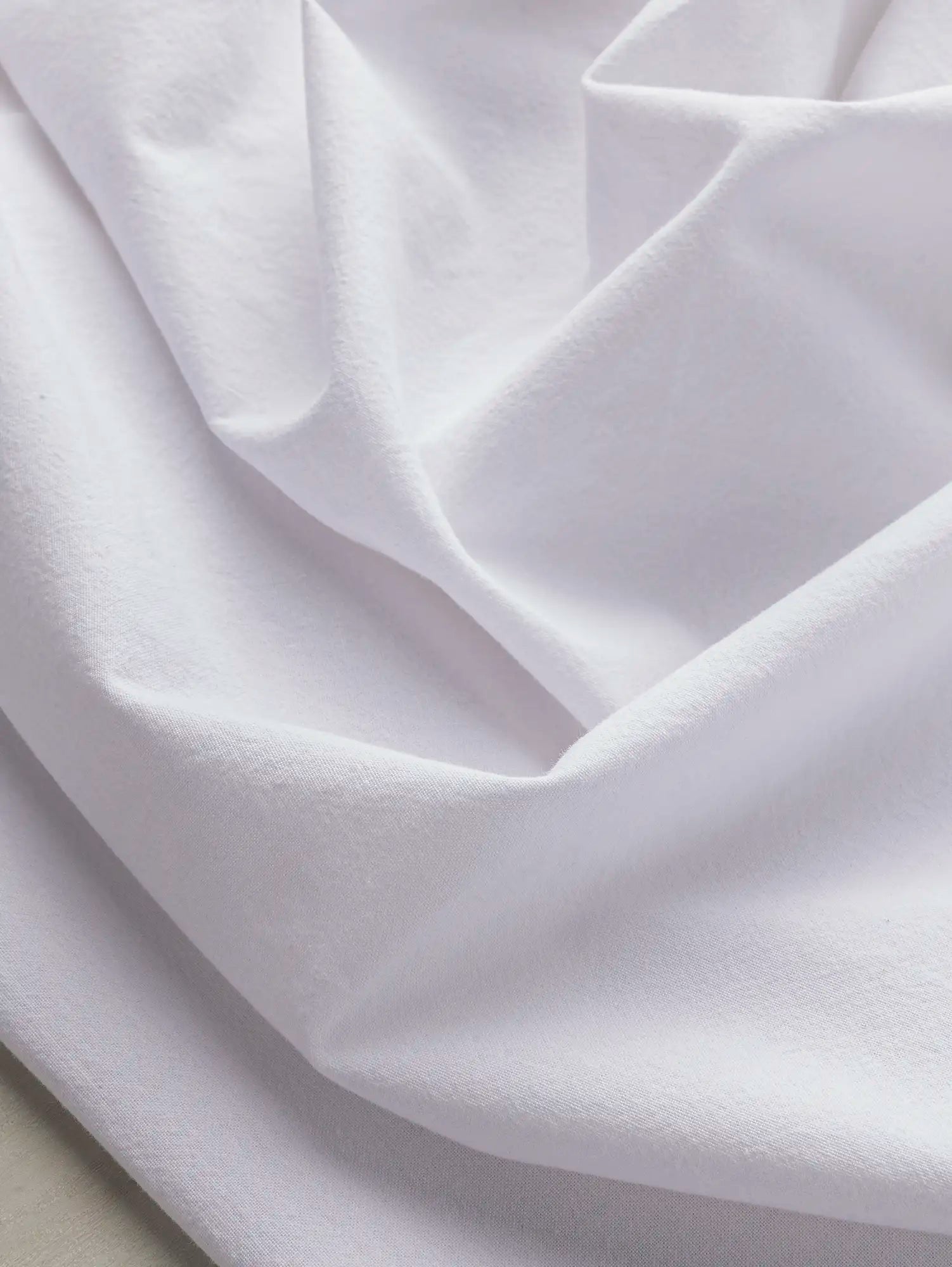 F-COT200-021-Tumbled-Non-Stretch-Cotton-White-Core-Fabrics-scrunched.webp