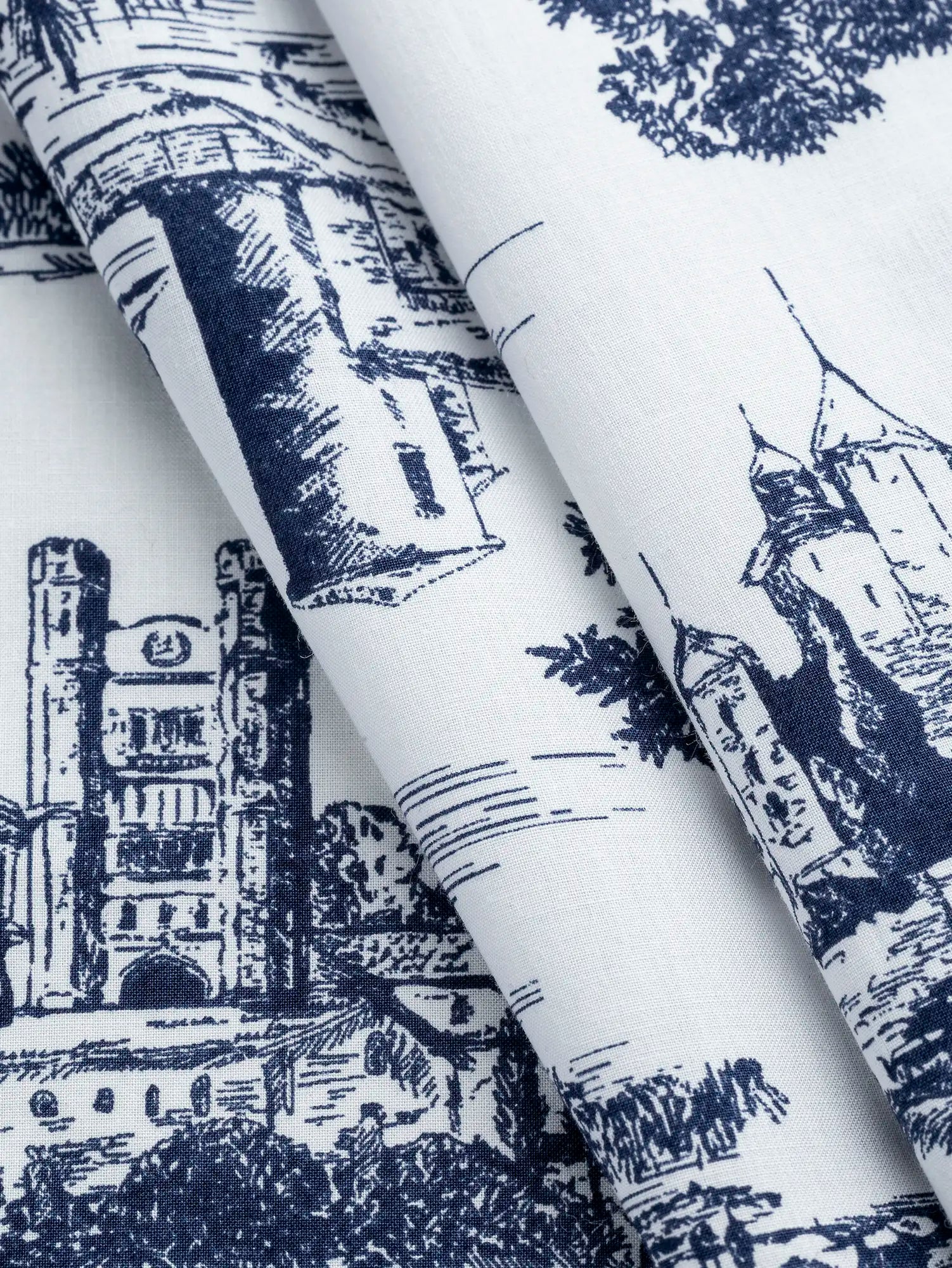 F-COT406-Tuscany-Toile-Print-Japanese-Cotton-Lawn-White-and-Indigo-Core-Fabrics-fold.webp