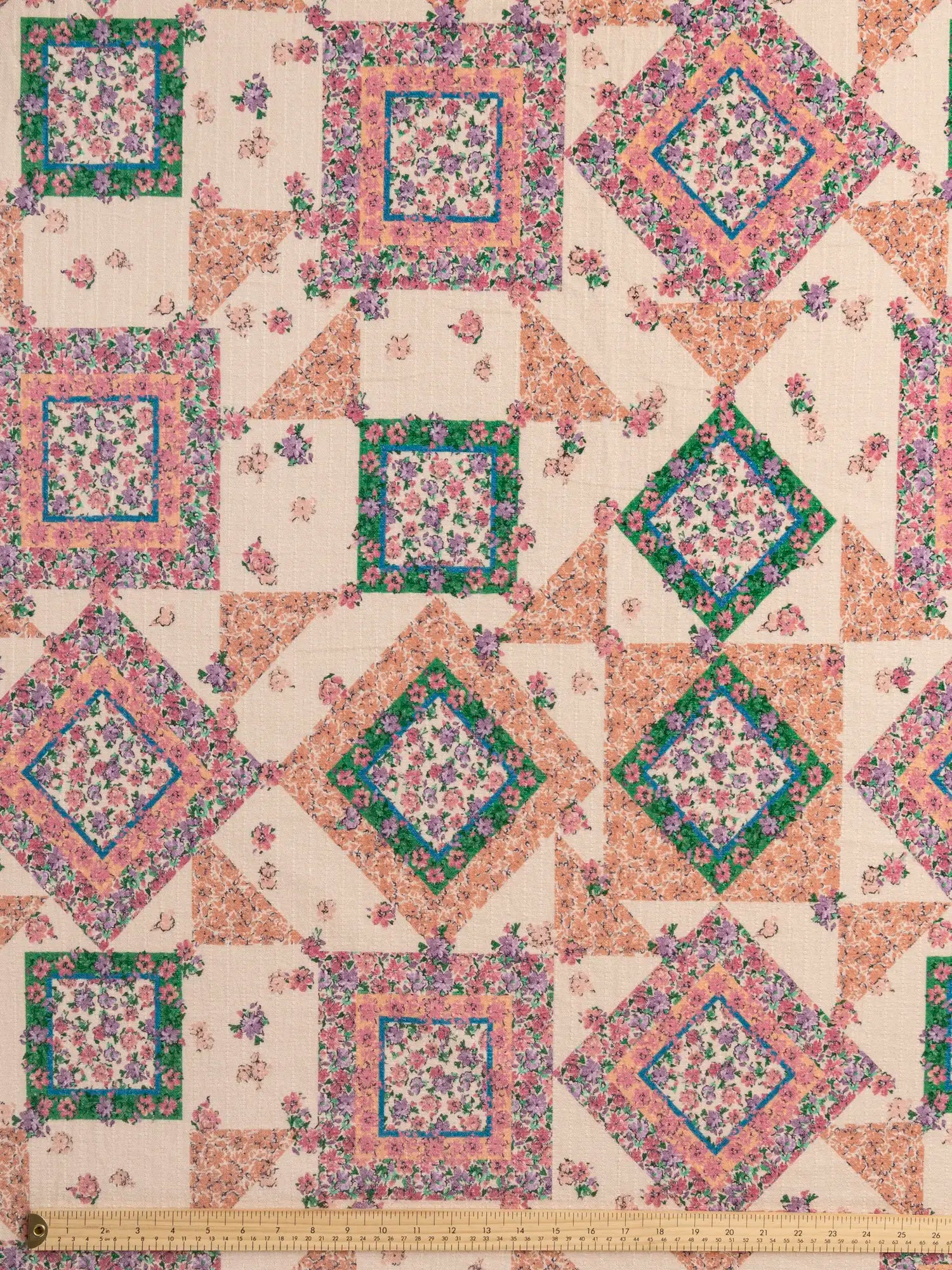 F-COT444-Vintage-Flower-Quilt-Print-Cotton-Beige-Peach-Green-and-Pink-Core-Fabrics-ruler.webp