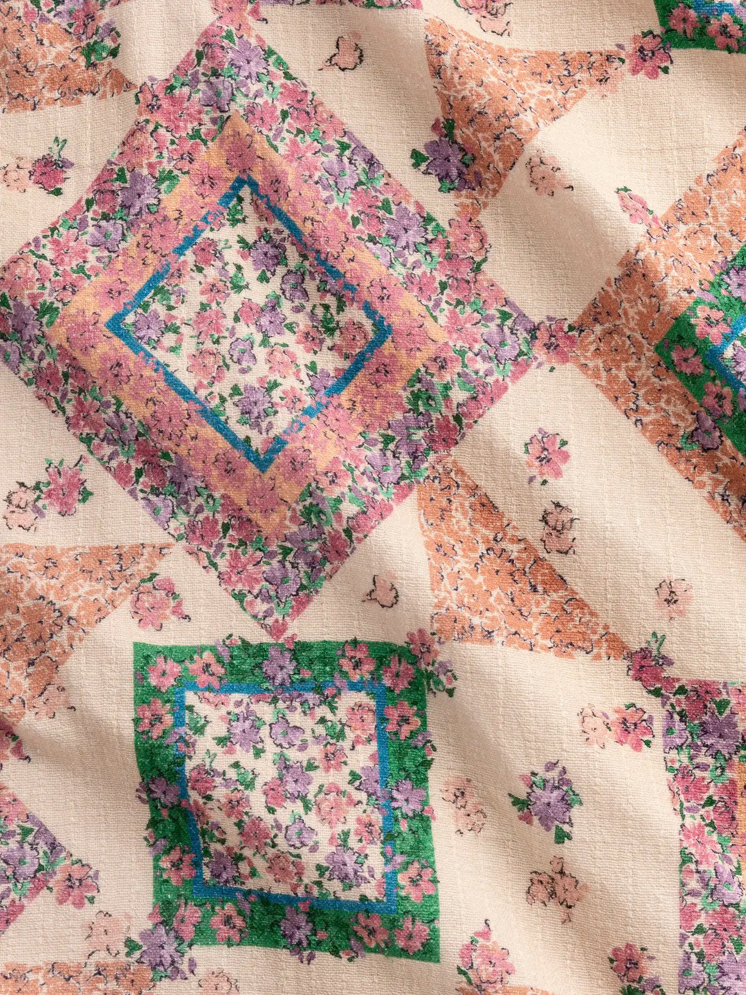 F-COT444-Vintage-Flower-Quilt-Print-Cotton-Beige-Peach-Green-and-Pink-Core-Fabrics-scrunched.webp