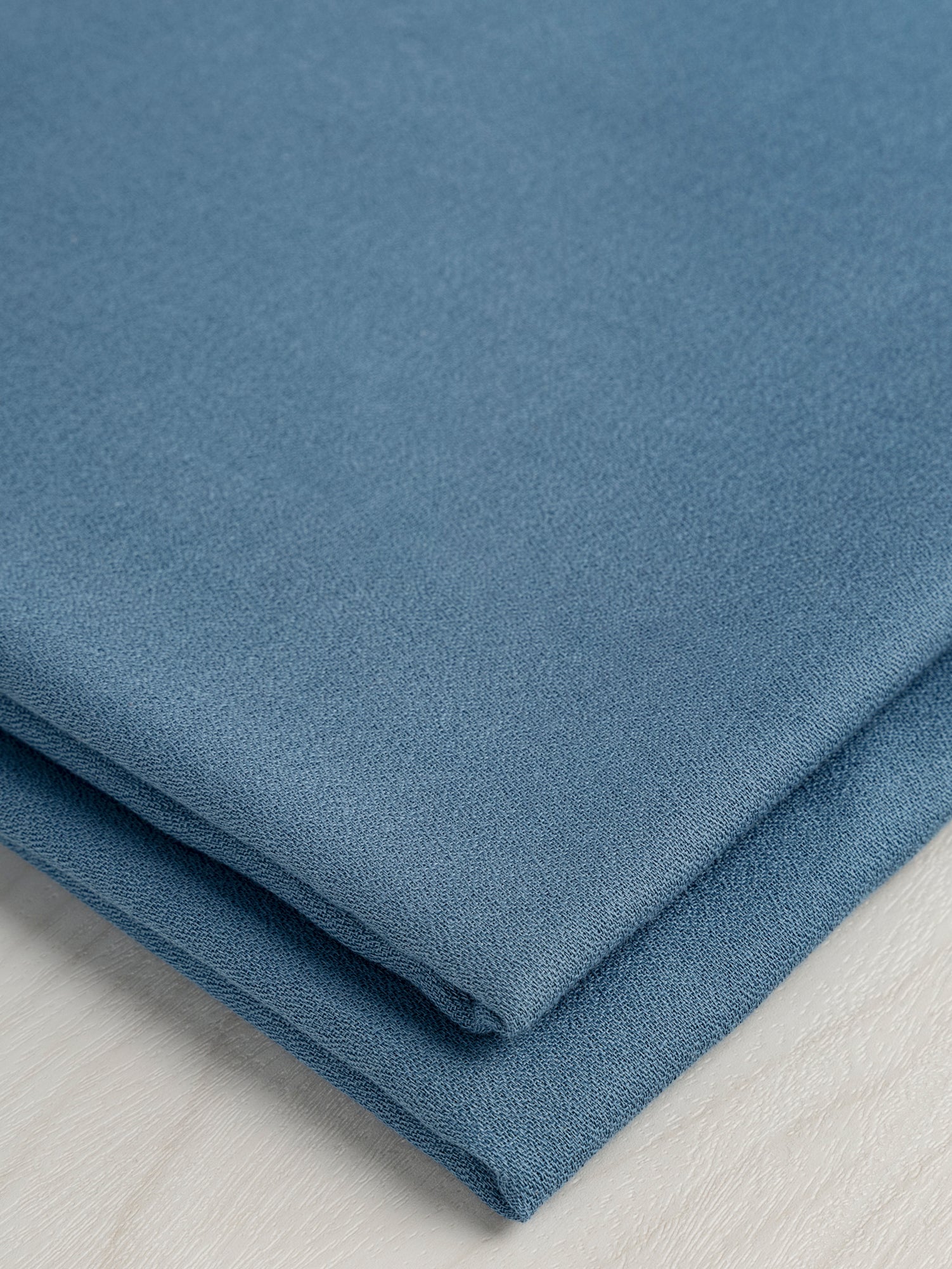 F-DEA057-Viscose-Crepe-Deadstock-Blue-Pond-Core-Fabrics-fold.JPG