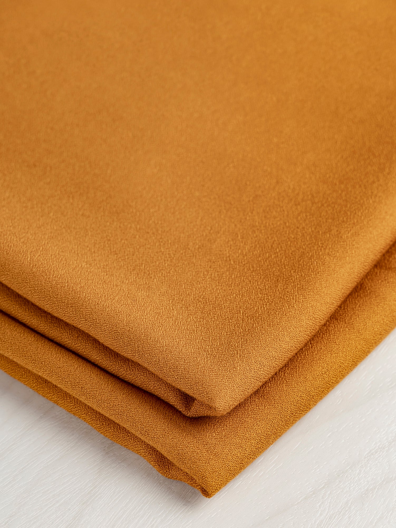 F-DEA055-Viscose-Crepe-Deadstock-Copper-Core-Fabrics-fold.JPG