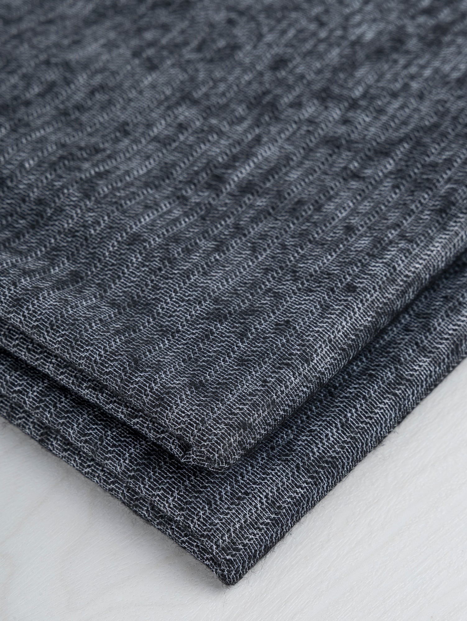 N-INT013-002 - ViscosePoly weft interfacing - Black-V4_LN-INT013-002-Viscose-Poly-Midweight-Fusible-Weft-Interfacing-for-Tailoring-Black-Core-Fabrics-fold.JPG