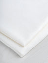 N-INT013-001-Viscose-Poly-Midweight-Fusible-Weft-Interfacing-for-Tailoring- White-Core-Fabrics-fold.JPG