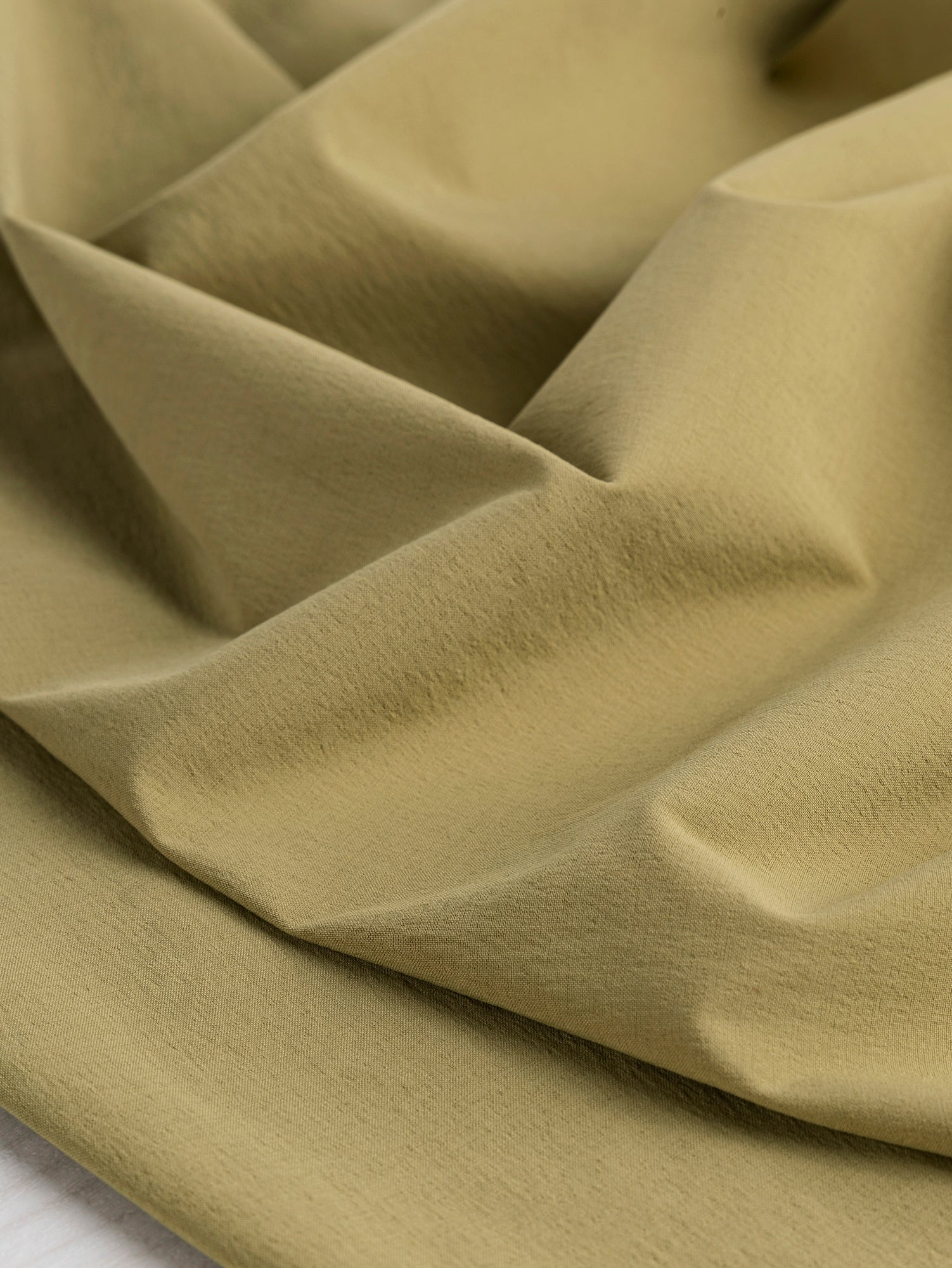 F-NYL018-001-Warp-Stretch-Wicking-Nylon-Deadstock-Driftwood-Core-Fabrics-Scrunched