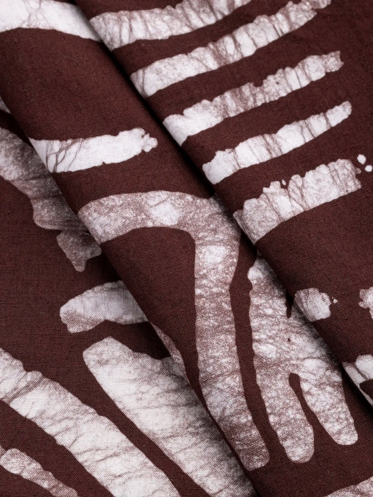 F-COT425-Wave-Artisanal-Cotton-Batik-Chocolate-Core-Fabrics-fold.webp