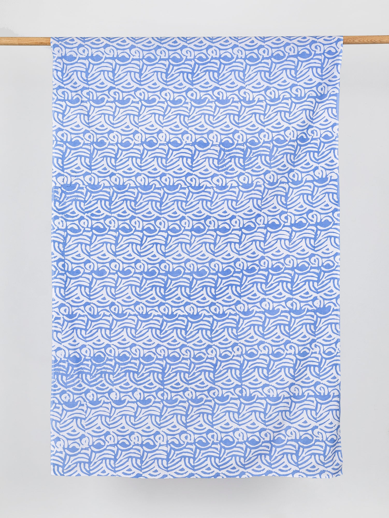 F-COT321-Wave-Artisanal-Cotton-Batik-Light-Blue-and-White-Core-Fabrics-draped