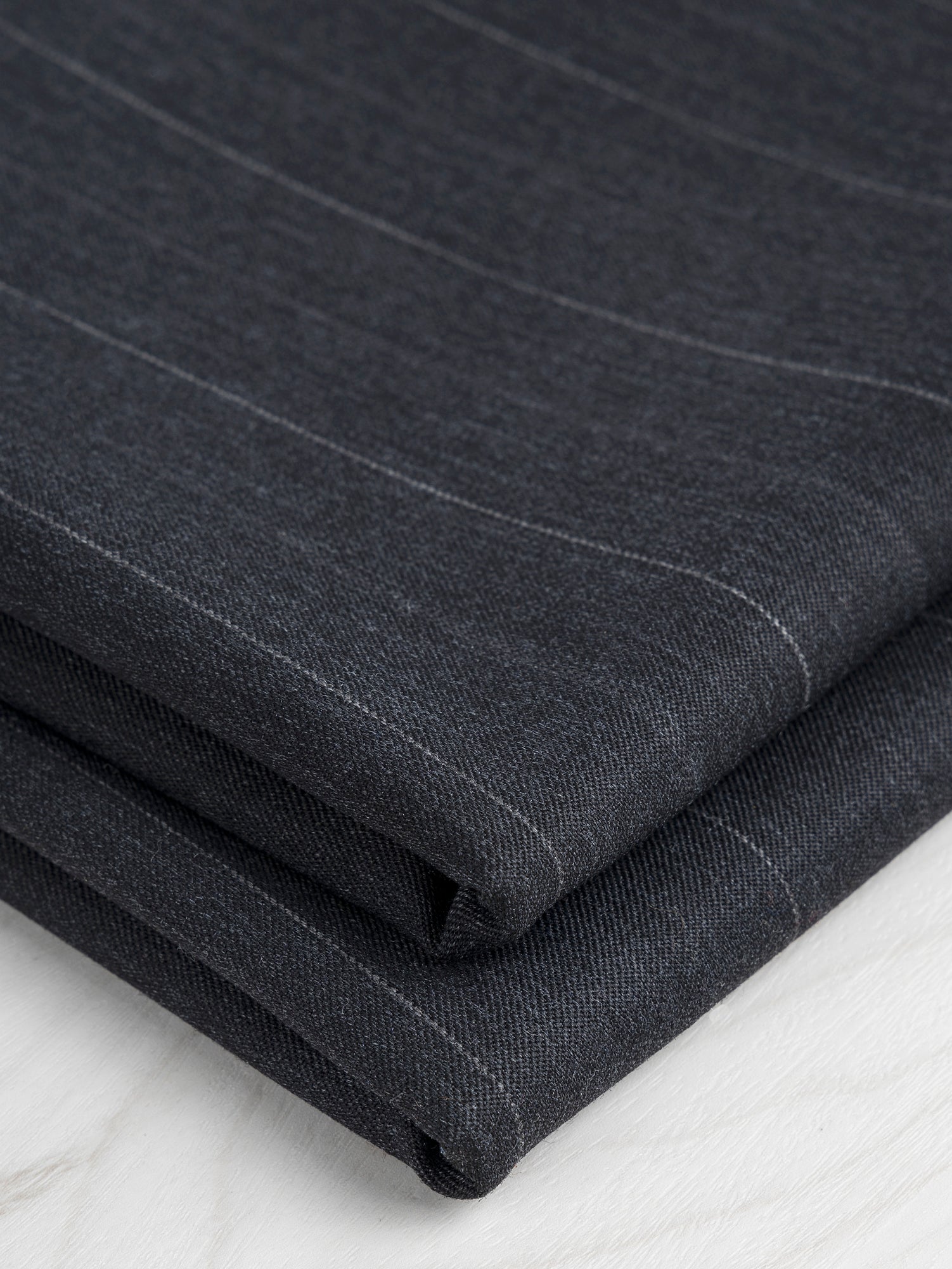 F-WOL104-Wide-Pinstripe-Italian-Wool-Twill-Suiting-Deadstock-Charcoal-Core-Fabrics-fold