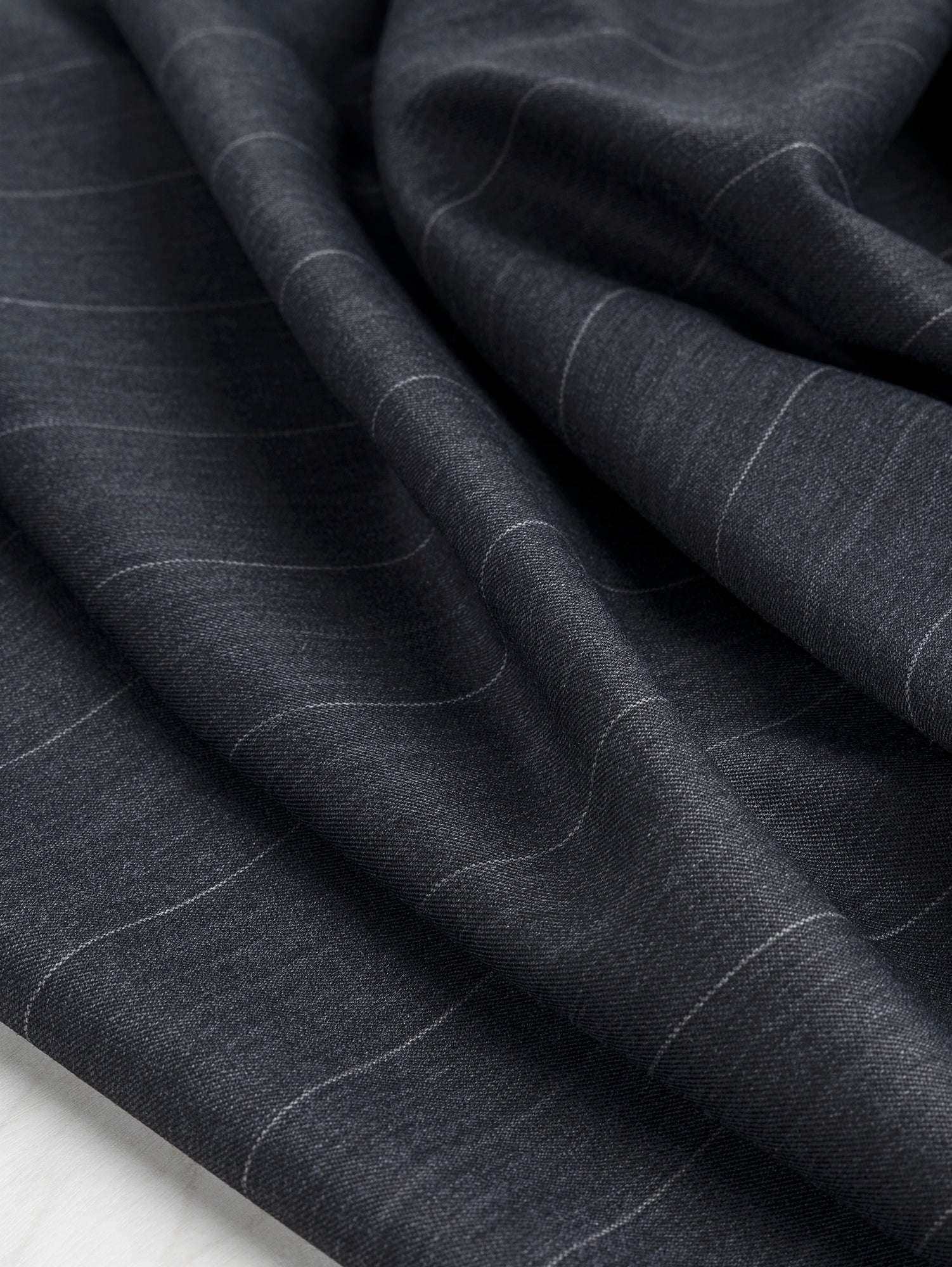 F-WOL104-Wide-Pinstripe-Italian-Wool-Twill-Suiting-Deadstock-Charcoal-Core-Fabrics-scrunched