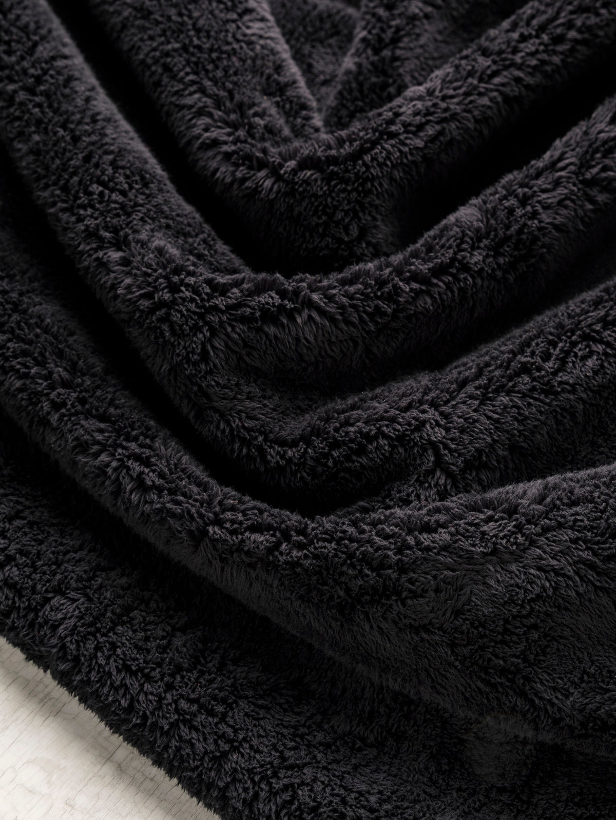 F-DEA258-Windblock-Polyester-Minky-Deadstock-Black-Core-Fabrics-scrunched.webp