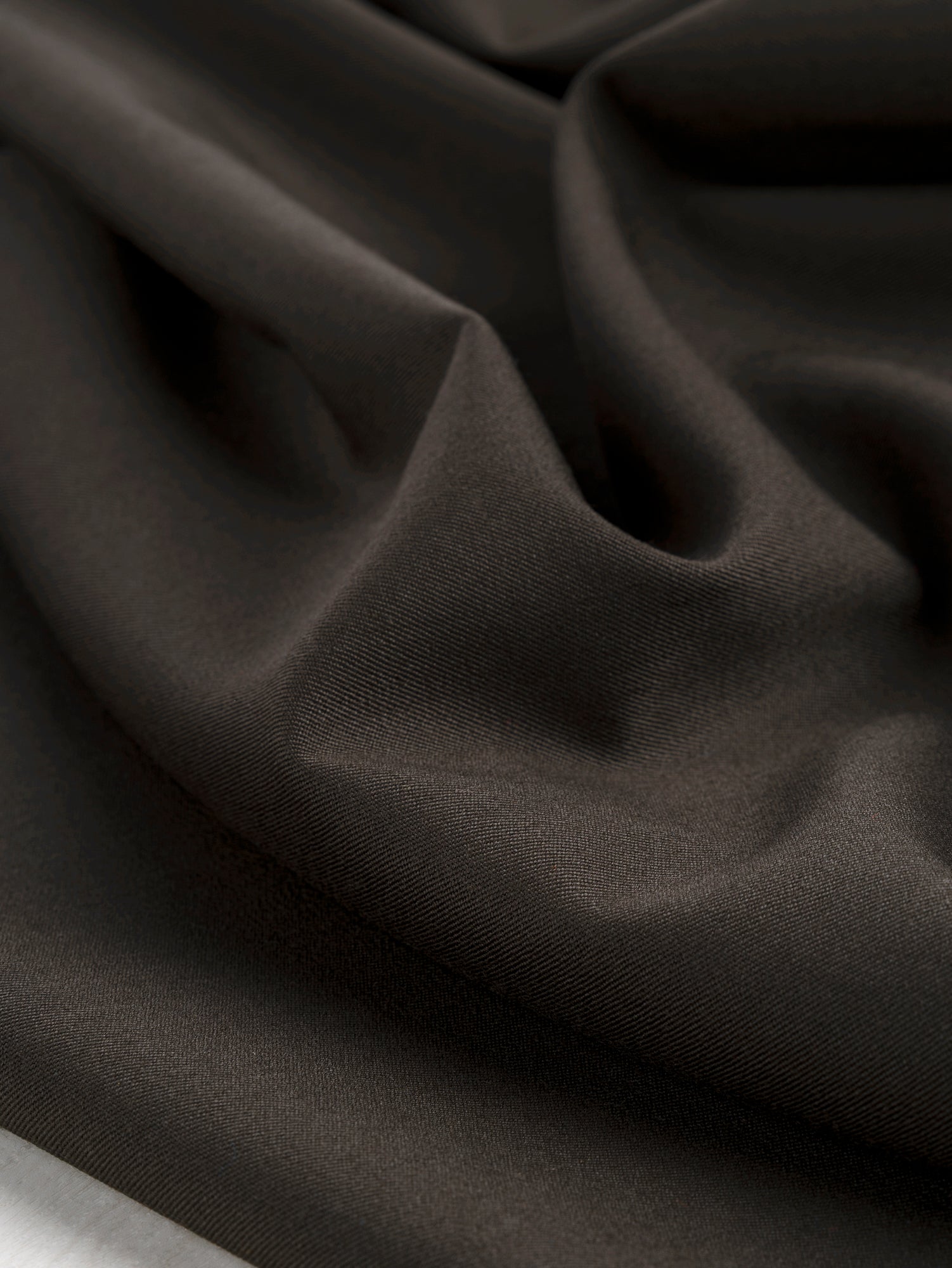 F-WOL110-Wool-Twill-Suiting-Deadstock-Dark-Olive-Core-Fabrics-scrunched.JPG