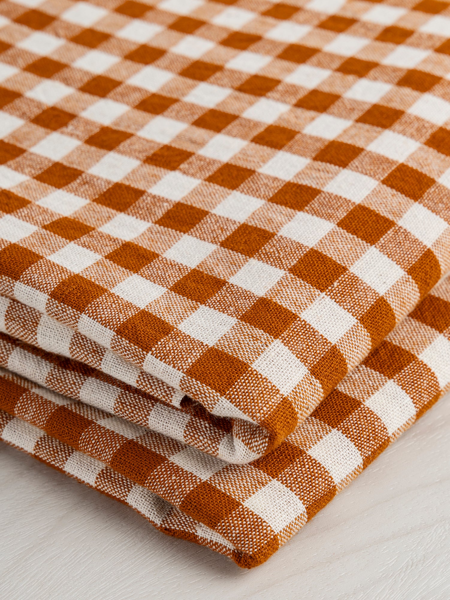 F-COT352-002-Yarn-Dyed-Handwoven-Gingham-Cotton-Rust+Cream-Core-Fabrics-fold.JPG