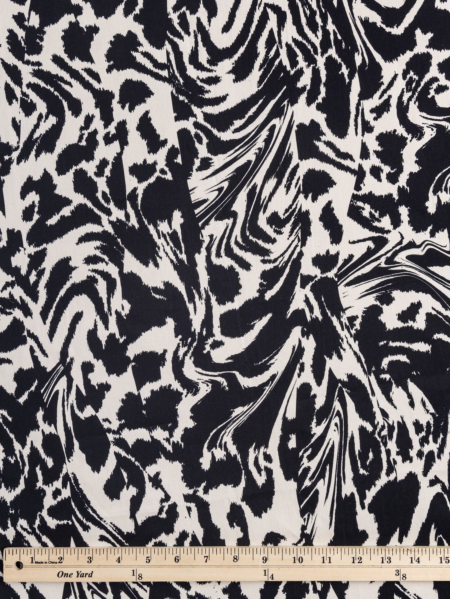 F-COT325-Zebra-Print-Stretch-Cotton-Bottomweight-Black-Cream-Core-Fabrics-ruler