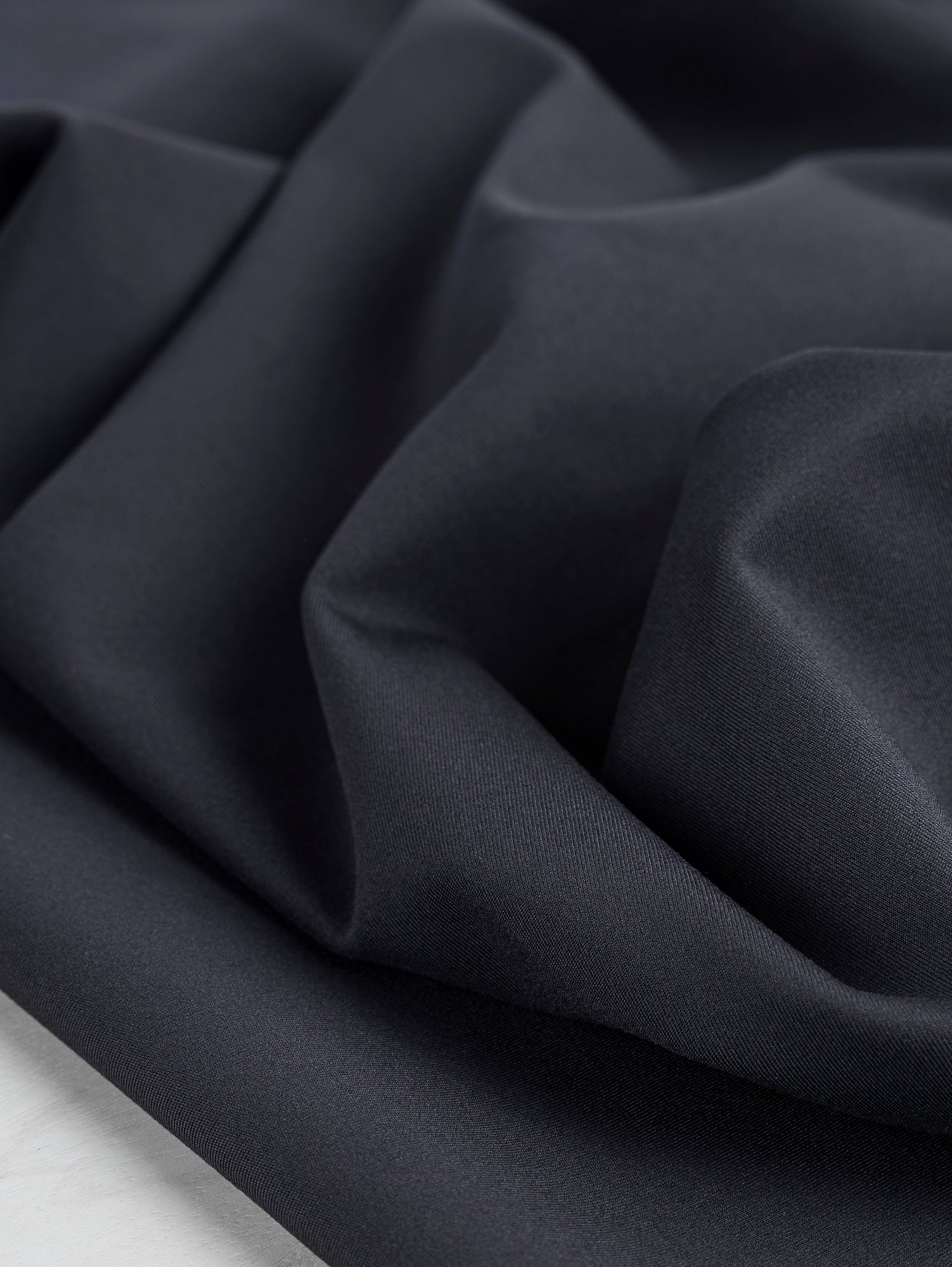 F-PES031-001-rPET-Wicking-Interlock-Deadstock-Black-Core-Fabrics-Scrunched