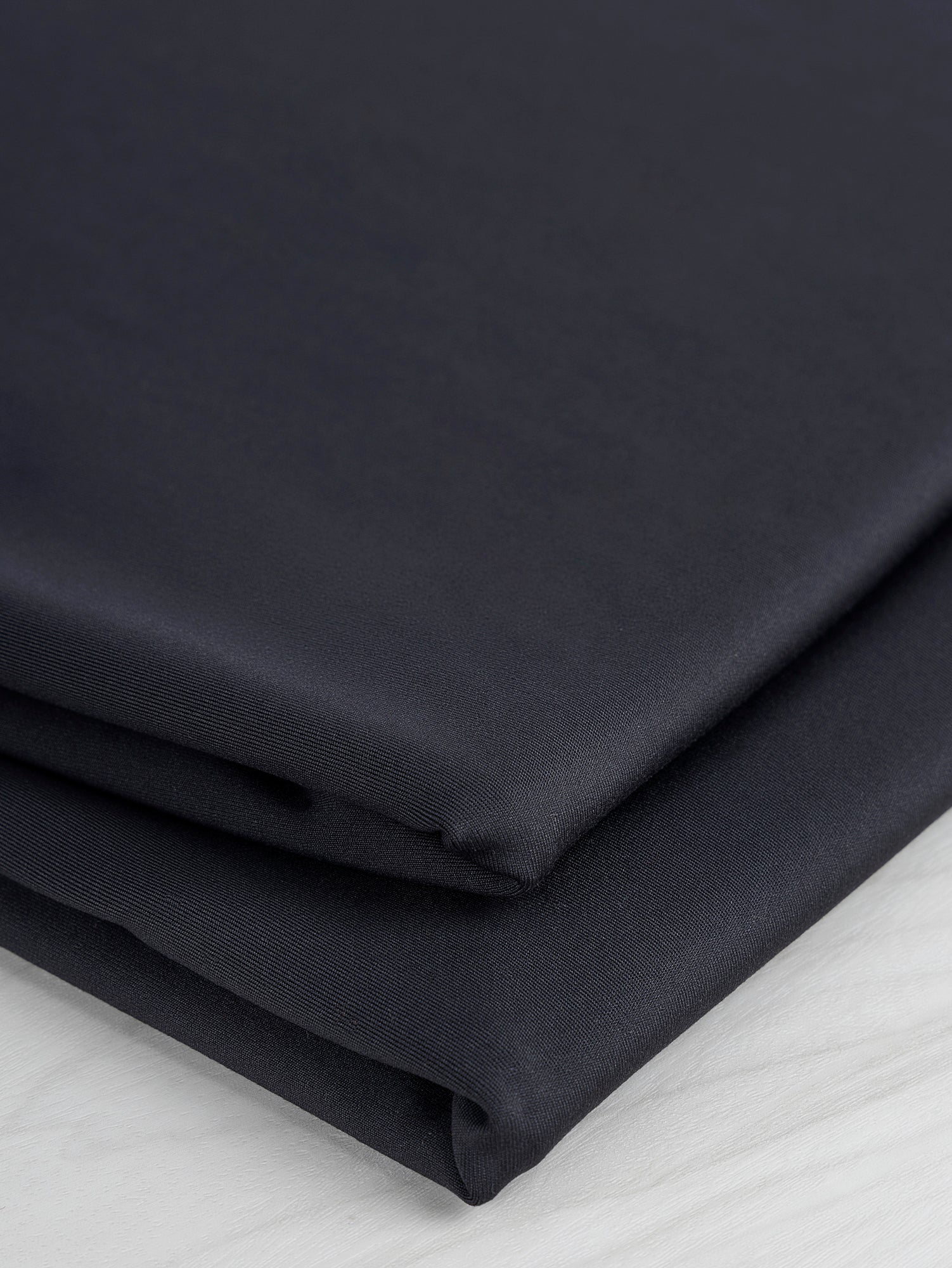 F-PES031-001-rPET-Wicking-Interlock-Deadstock-Black-Core-Fabrics-Fold