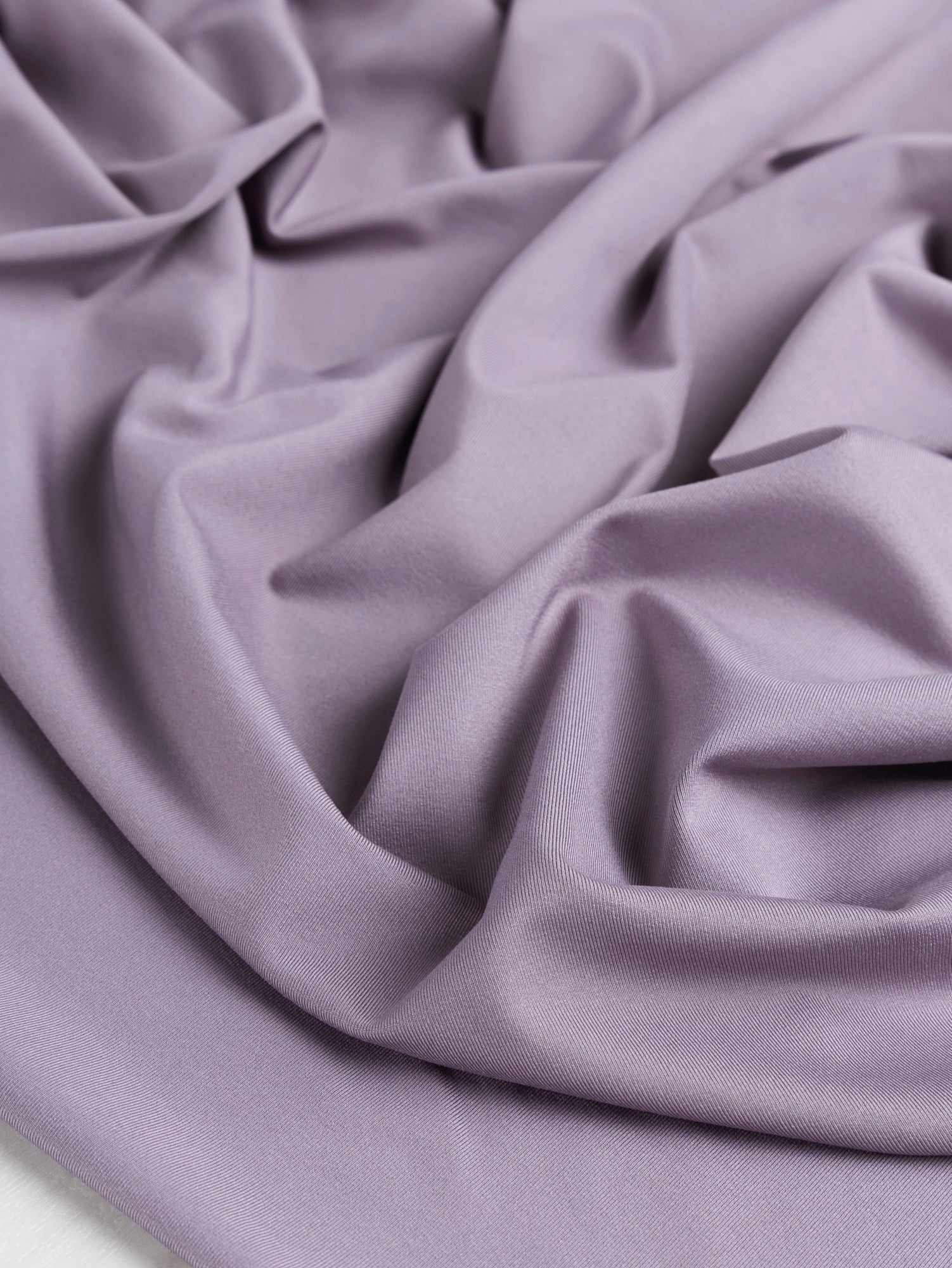 F-PES034-001-rPet-Chito-Performance-Stretch-Knit-Deadstock-Lilac-Core-Fabrics-scrunched.JPG