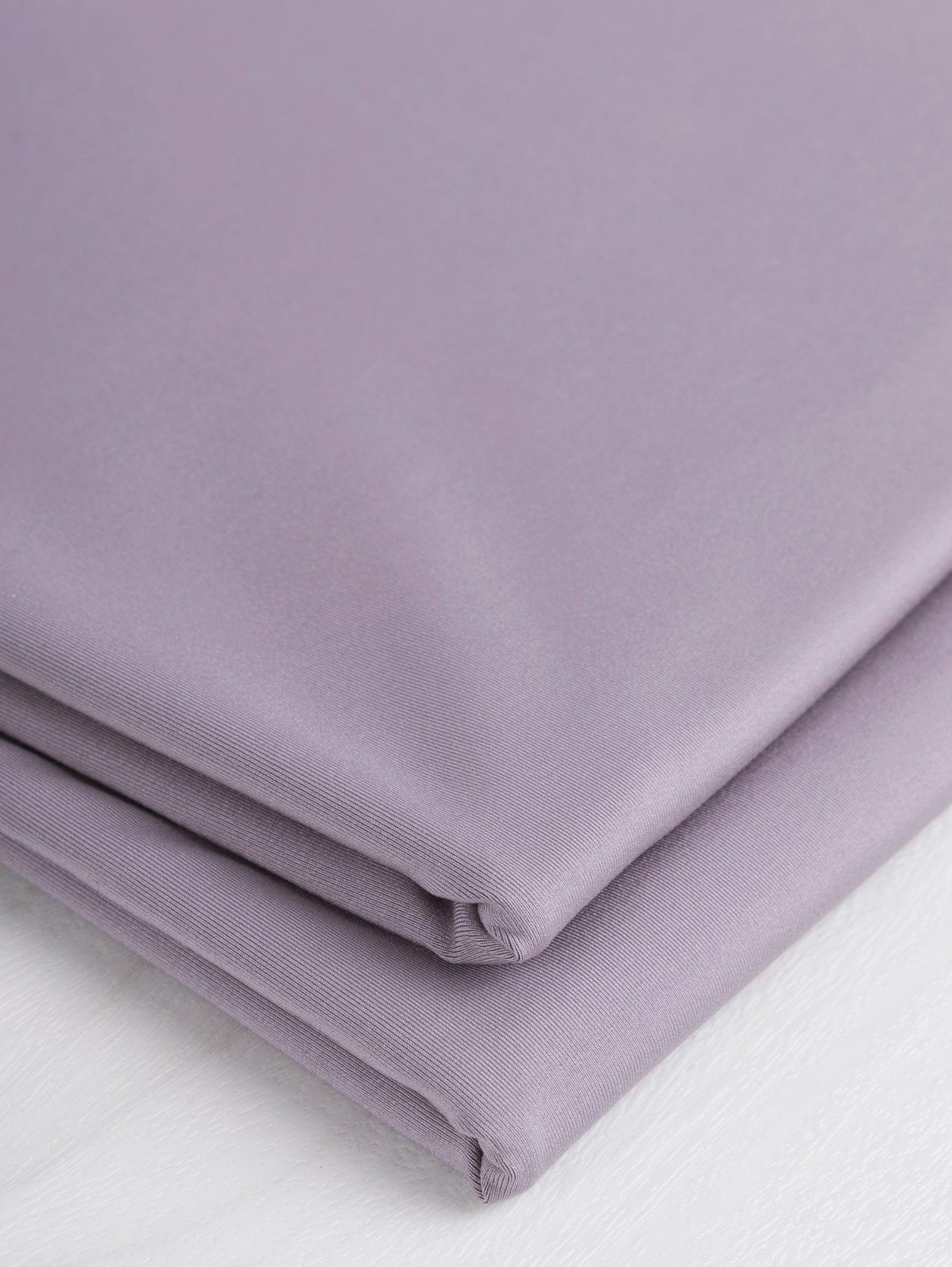 F-PES034-001-rPet-Chito-Performance-Stretch-Knit-Deadstock-Lilac-Core-Fabrics-fold.JPG