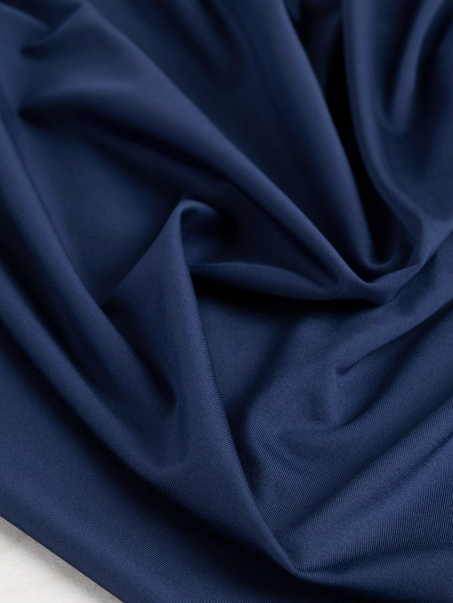 F-PES034-002-rPet-Chito-Performance-Stretch-Knit-Deadstock-Navy-Core-Fabrics-scrunched.JPG