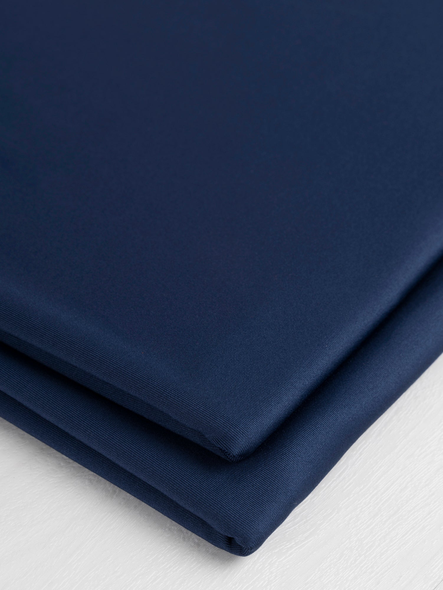 F-PES034-002-rPet-Chito-Performance-Stretch-Knit-Deadstock-Navy-Core-Fabrics-fold.JPG