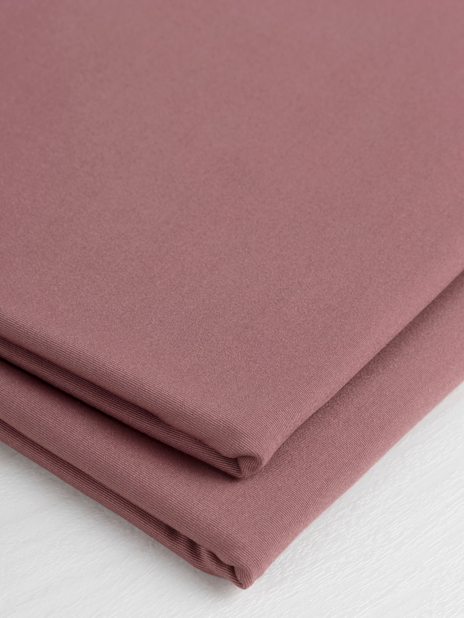 F-PES034-003-rPet-Chito-Performance-Stretch-Knit-Deadstock-Rose-Brown-Core-Fabrics-fold.JPG