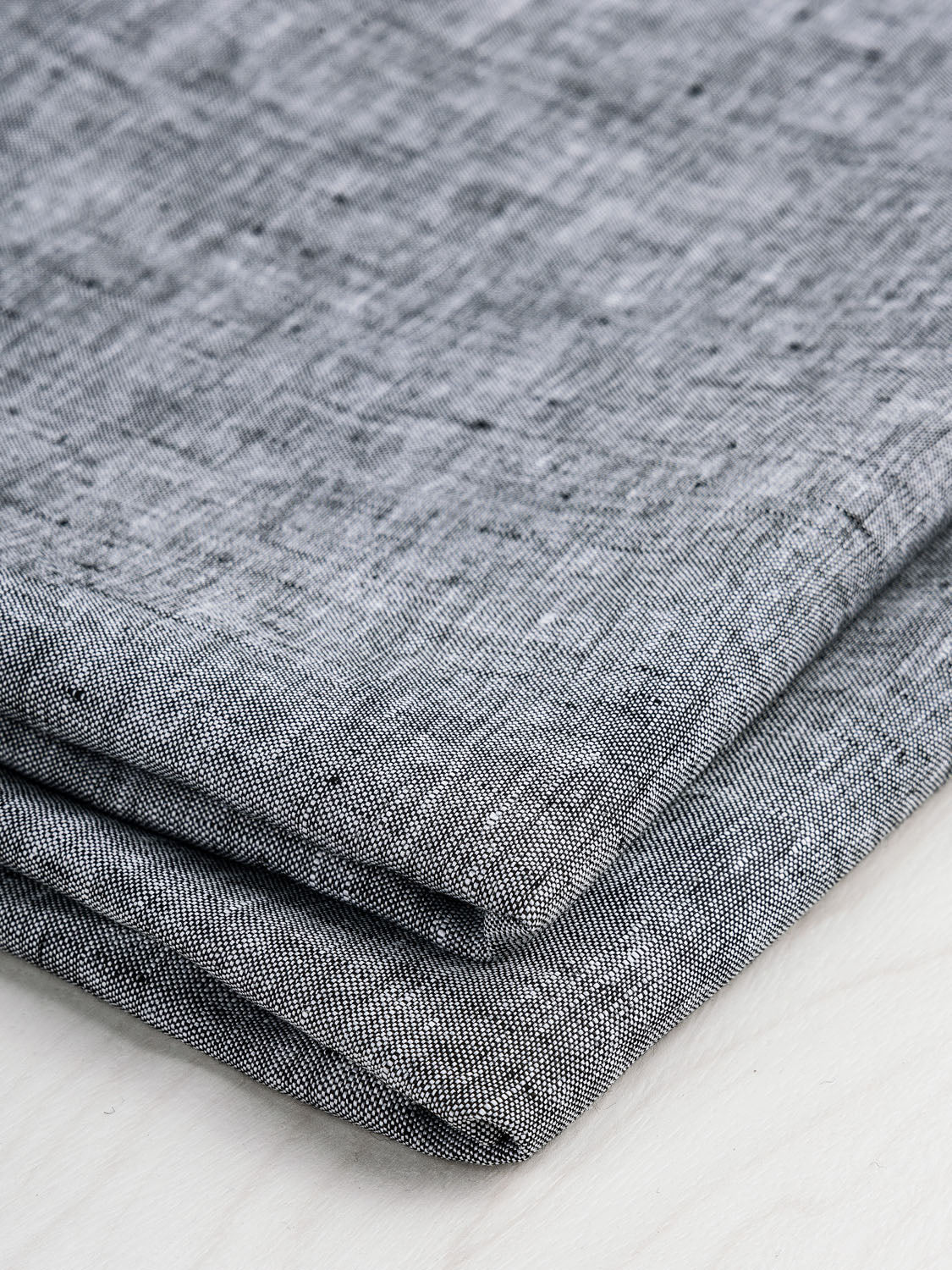 F-LIN025-002-Yarn-Dyed-Chambray-Linen-Black-Core-Fabrics-fold.jpg